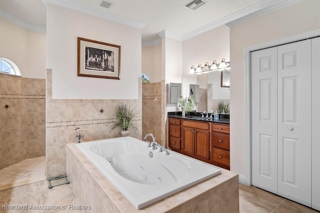 bathroom with vanity, ornamental molding, a relaxing tiled tub, and tile patterned floors