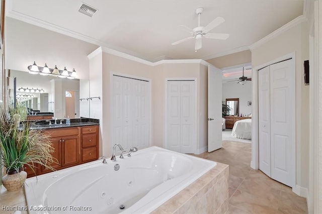 bathroom featuring crown molding, ceiling fan, tile patterned flooring, vanity, and tiled bath