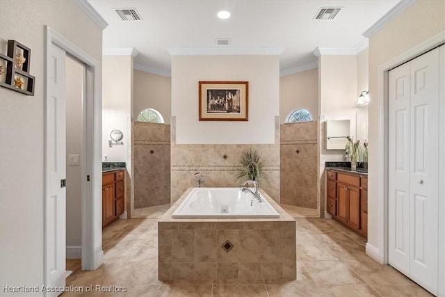 bathroom with vanity, tile patterned flooring, a relaxing tiled tub, and ornamental molding