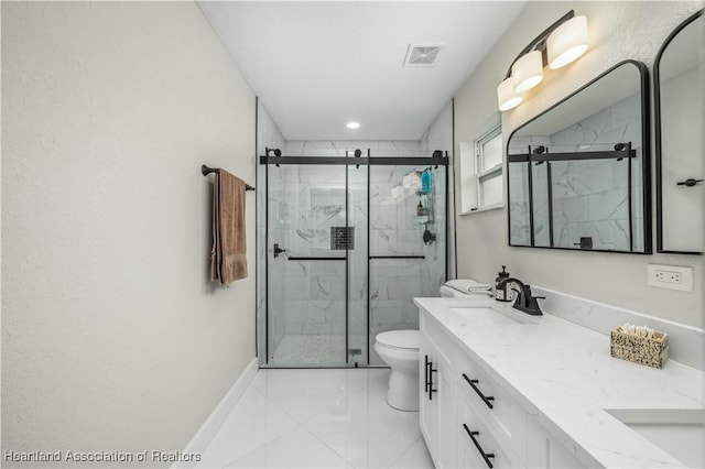 bathroom featuring vanity, toilet, and a shower with shower door