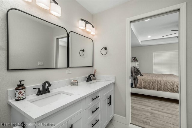 bathroom with ceiling fan and vanity