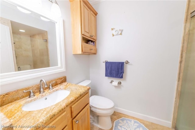 bathroom with tile patterned flooring, vanity, toilet, and a shower with shower door