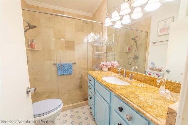 bathroom with walk in shower, tile patterned flooring, toilet, vanity, and ornamental molding