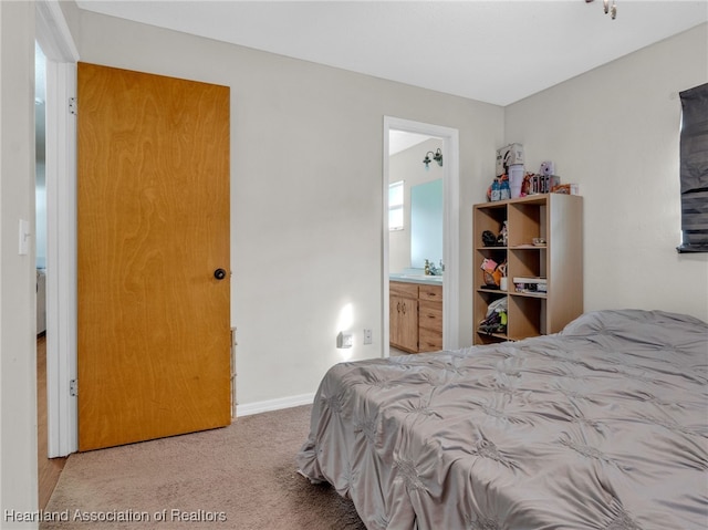 carpeted bedroom with ensuite bathroom