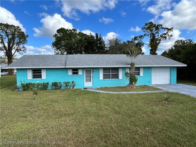 single story home with a front yard and a garage