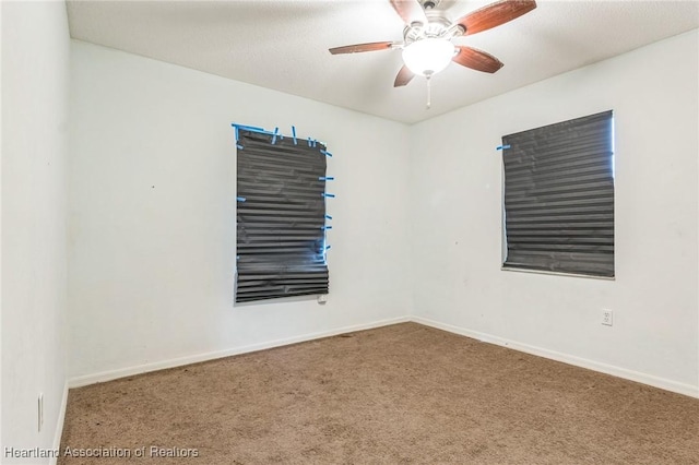 carpeted empty room with ceiling fan