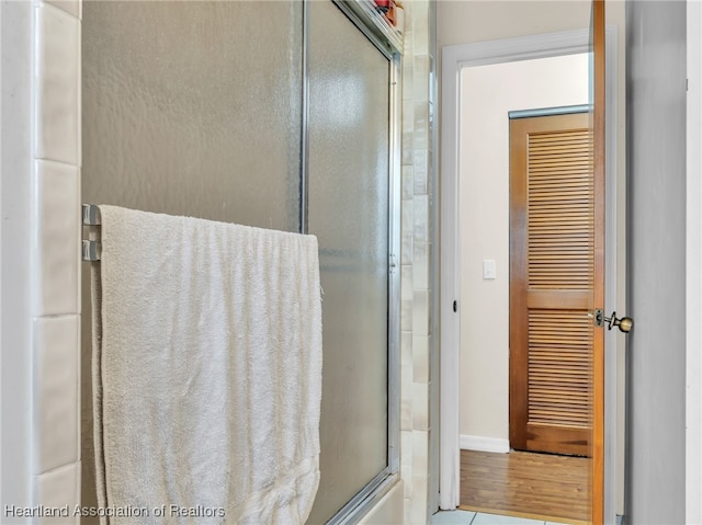 bathroom with an enclosed shower