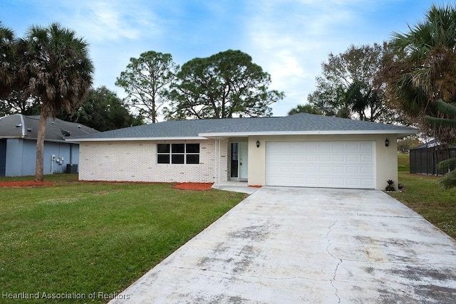 702 Catfish Rd, Lake Placid, FL 33852 - ranch-style home featuring driveway, a garage, and a front lawn