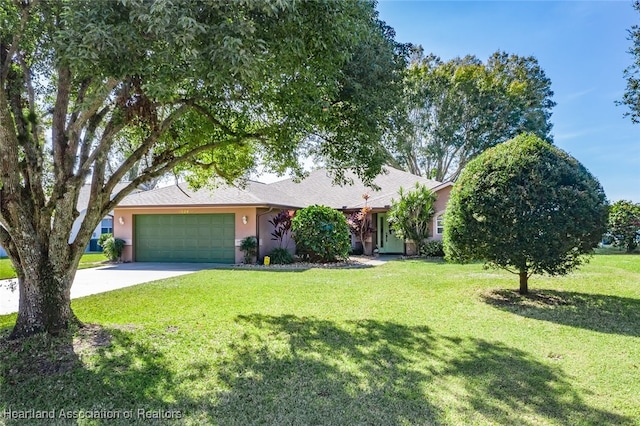 view of front of house with driveway, stucco siding, a garage, and a front yard