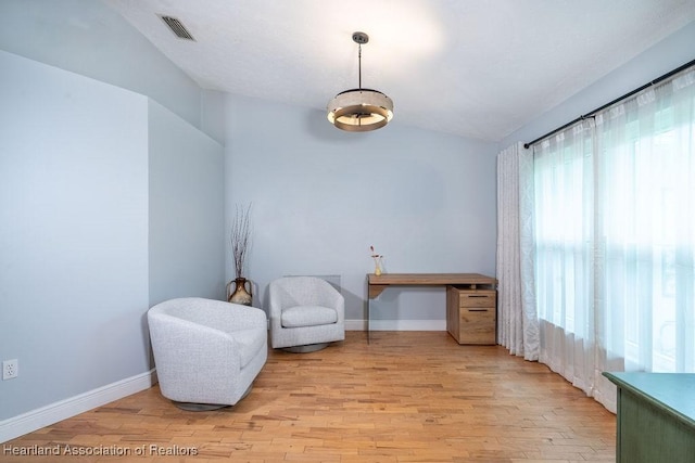 sitting room with light hardwood / wood-style flooring