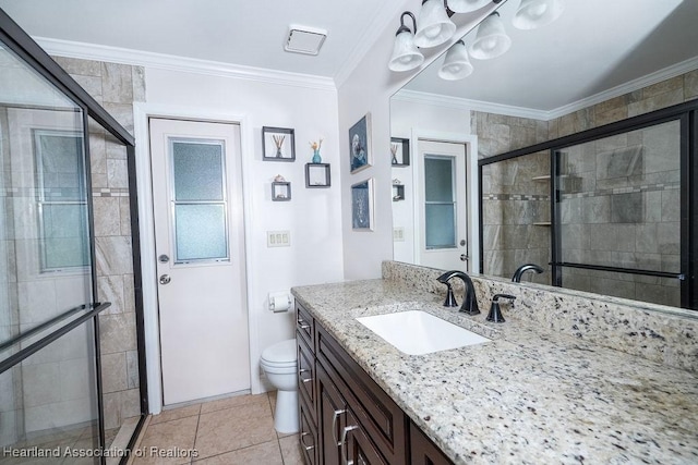 bathroom with vanity, a shower with door, crown molding, tile patterned flooring, and toilet