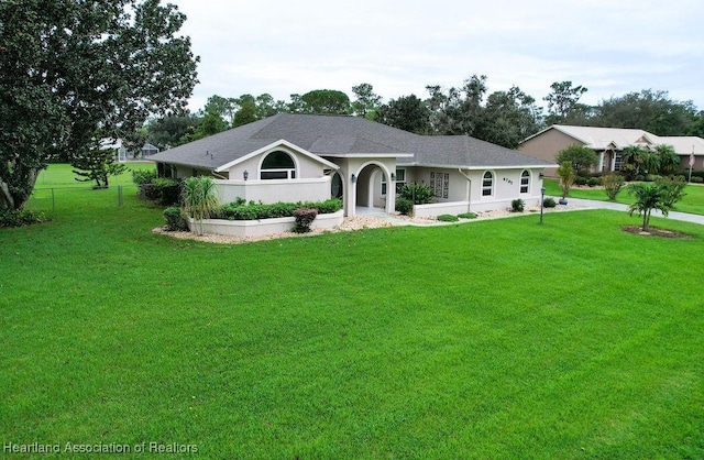 single story home with a front yard