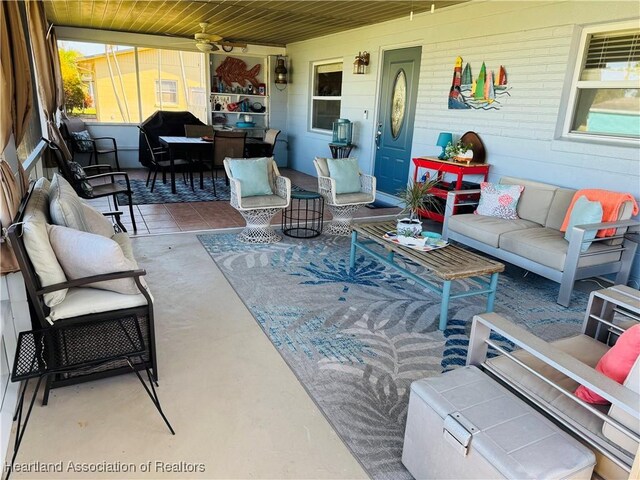 view of patio with outdoor lounge area and a porch