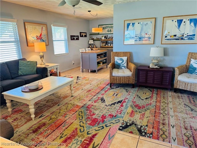 tiled living room with ceiling fan