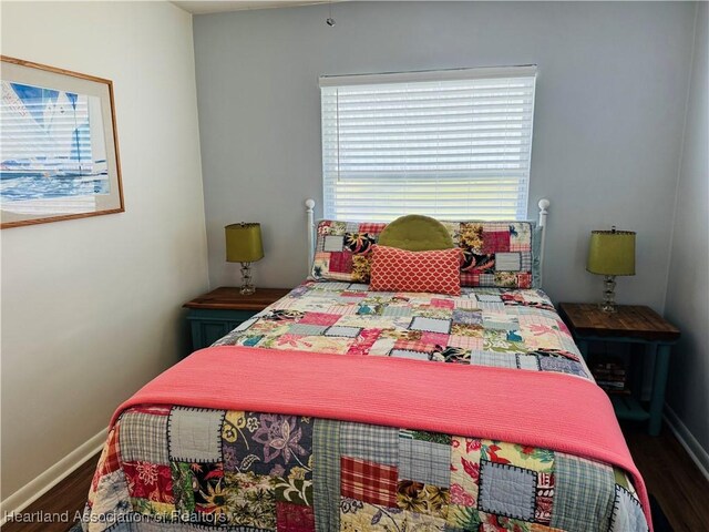 bedroom featuring dark hardwood / wood-style flooring