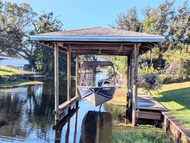 dock area with a water view