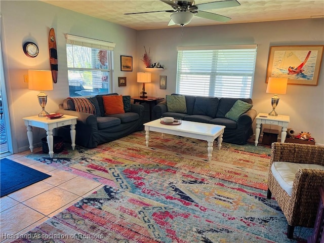 tiled living room with ceiling fan