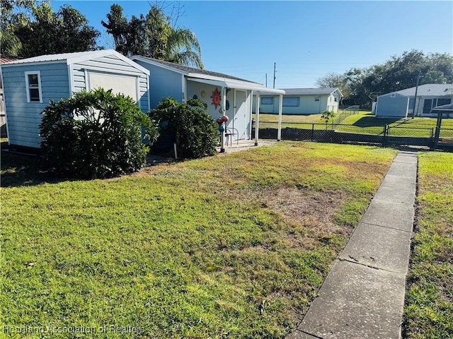 view of yard with a storage unit