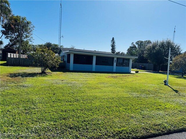 view of yard featuring a sunroom