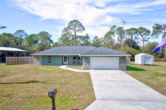 single story home featuring a front lawn and a storage unit