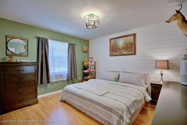 bedroom with light wood-type flooring