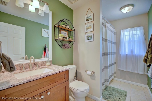 bathroom with tile patterned flooring, vanity, a shower with shower curtain, and toilet