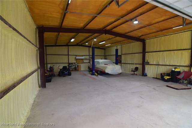 garage featuring a carport