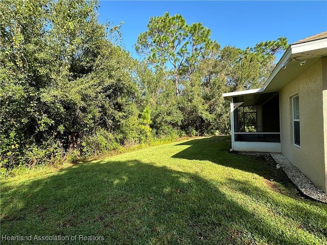 view of yard with a sunroom