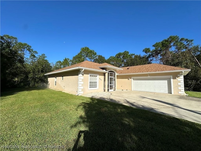 single story home featuring a front lawn and a garage