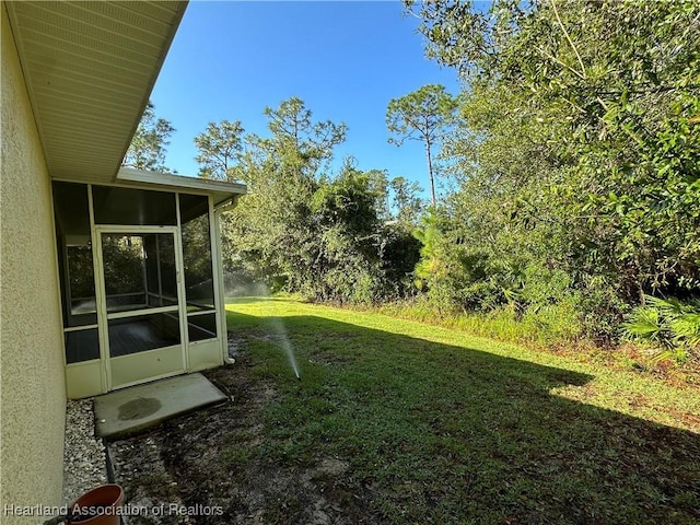 view of yard featuring a sunroom