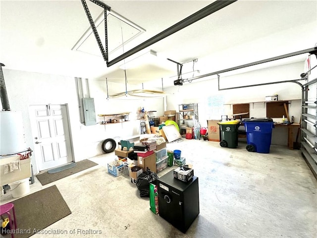 garage featuring electric panel and a garage door opener