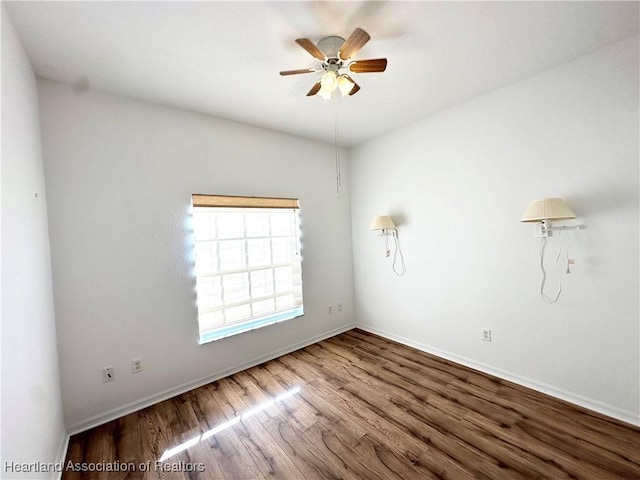 unfurnished room featuring hardwood / wood-style flooring and ceiling fan