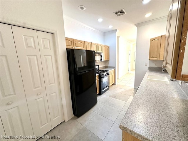 kitchen with black appliances, light tile patterned floors, ornamental molding, and light brown cabinetry