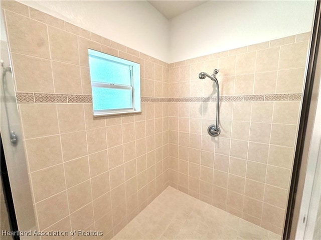 bathroom with tiled shower