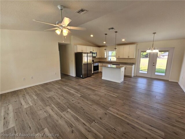2859 N Lancaster Rd, Avon Park, FL 33825 - kitchen with open floor plan, dark countertops, stainless steel appliances, and french doors