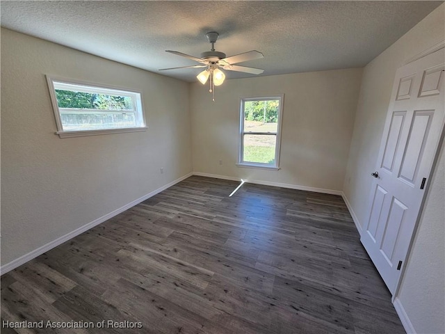 2859 N Lancaster Rd, Avon Park, FL 33825 - unfurnished bedroom featuring a textured ceiling, a ceiling fan, dark wood-style flooring, and baseboards