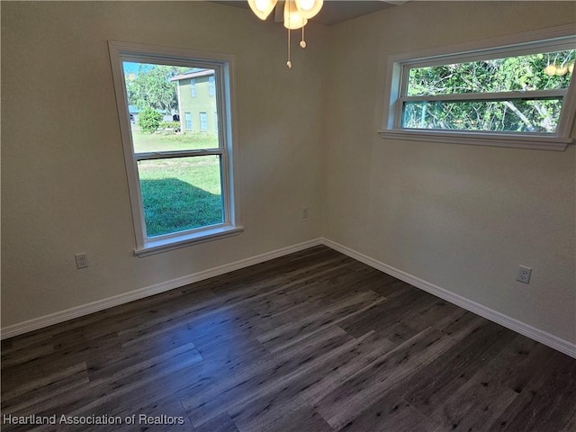 2859 N Lancaster Rd, Avon Park, FL 33825 - empty room with baseboards, ceiling fan, and dark wood finished floors