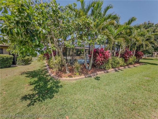 view of yard featuring a lanai