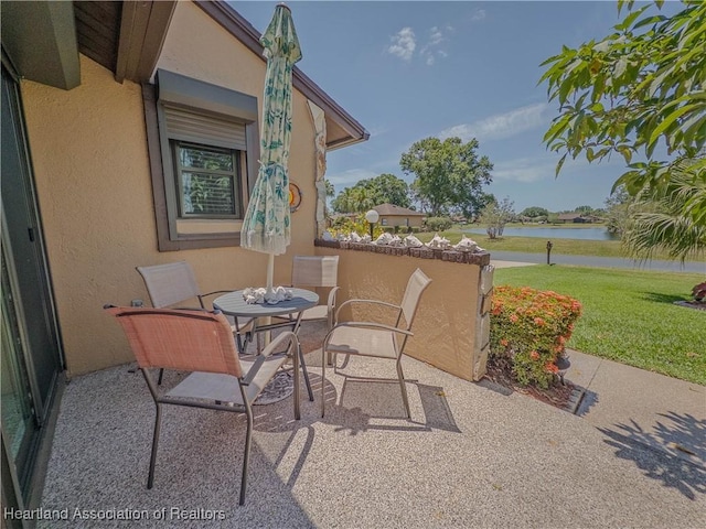 view of patio / terrace with a water view