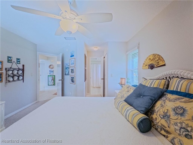 carpeted bedroom featuring visible vents and ceiling fan