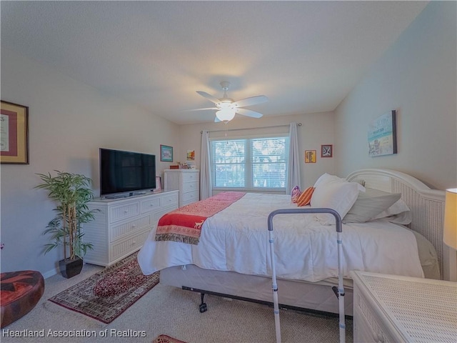 bedroom with carpet flooring, ceiling fan, and baseboards