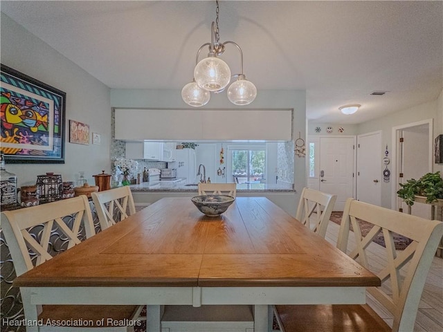dining area featuring visible vents