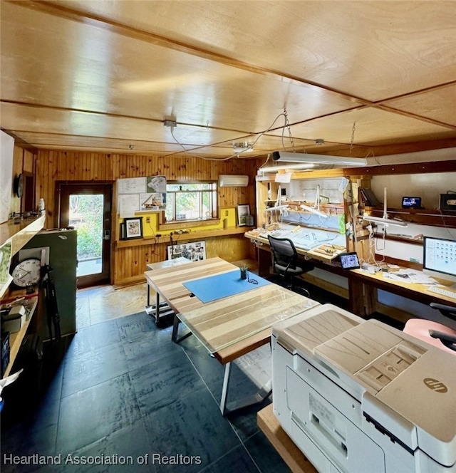 recreation room featuring a workshop area and wooden walls