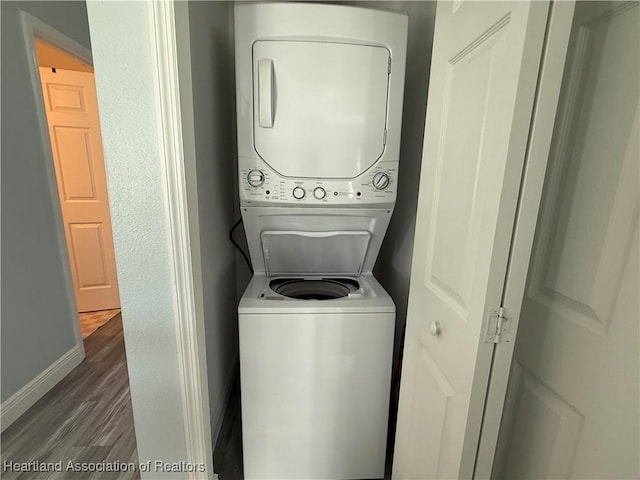 424 Branbury Ave, Lake Placid, FL 33852 - washroom with stacked washer and clothes dryer and wood finished floors