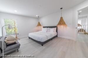 11200 S Jefferson Ave, Lake Placid, FL 33852 - bedroom featuring wood finished floors, baseboards, and recessed lighting