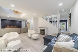 11200 S Jefferson Ave, Lake Placid, FL 33852 - living area with recessed lighting, stairway, and a fireplace