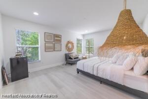 11200 S Jefferson Ave, Lake Placid, FL 33852 - bedroom with recessed lighting, baseboards, and wood finished floors
