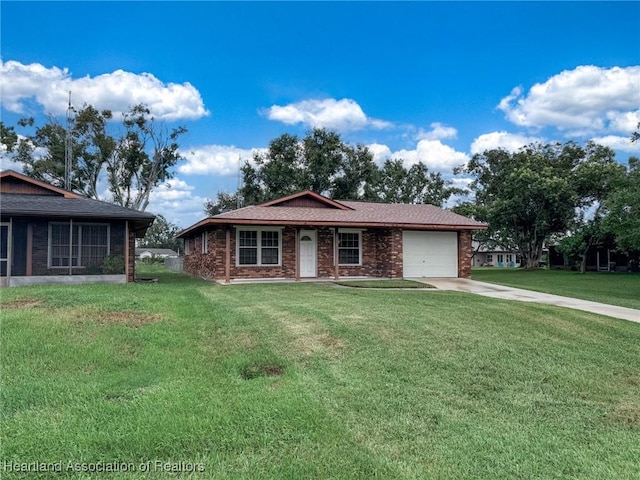 view of front of house with a front yard and a garage