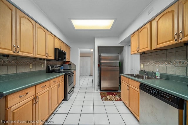 kitchen featuring sink, light tile patterned floors, stainless steel appliances, and tasteful backsplash