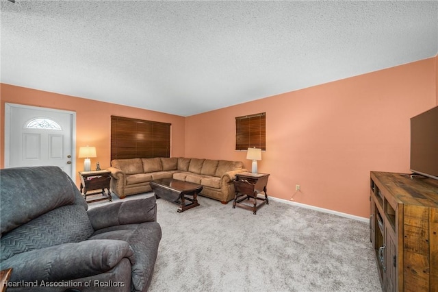 living room with light carpet and a textured ceiling